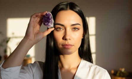 Crystals that help with focus: A woman holding an amethyst