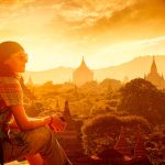 Sacred Sites Travel Throughout Southeast Asia: A Tourist Gazing at the Bagan Temples at Sunset