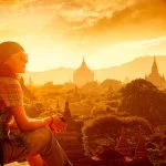 Sacred Sites Travel Throughout Southeast Asia: A Tourist Gazing at the Bagan Temples at Sunset