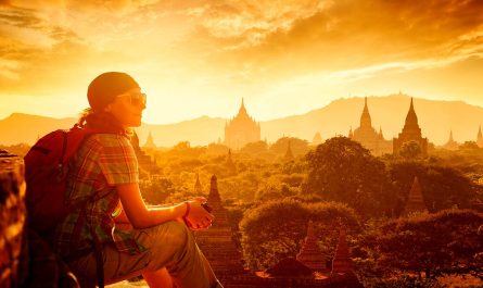 Sacred Sites Travel Throughout Southeast Asia: A Tourist Gazing at the Bagan Temples at Sunset