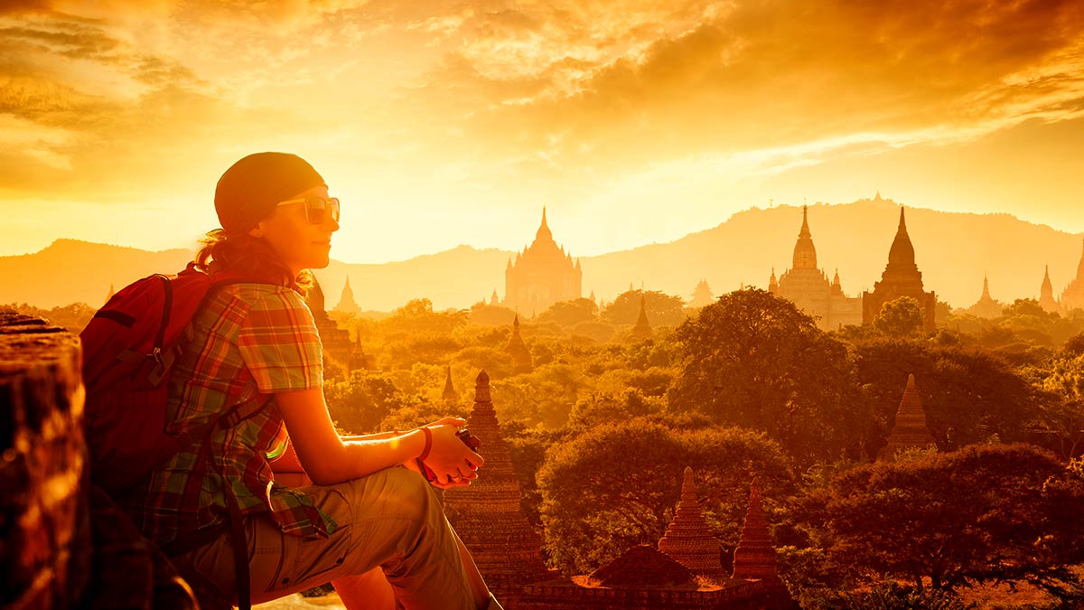 Sacred Sites Travel Throughout Southeast Asia: A Tourist Gazing at the Bagan Temples at Sunset
